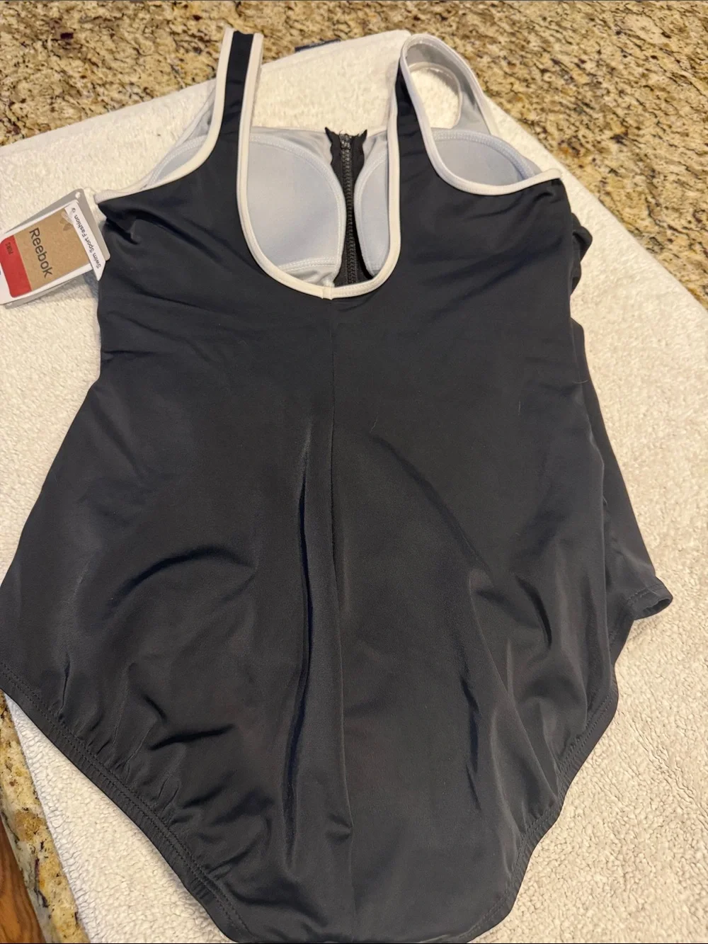 Reebok Black and White One-Piece Swimsuit with Front Zip. New and never worn.
